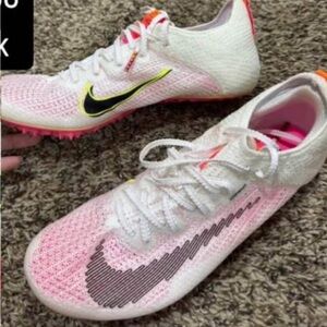 Nike Pink and White Athletic Shoes with Sleek Performance Design